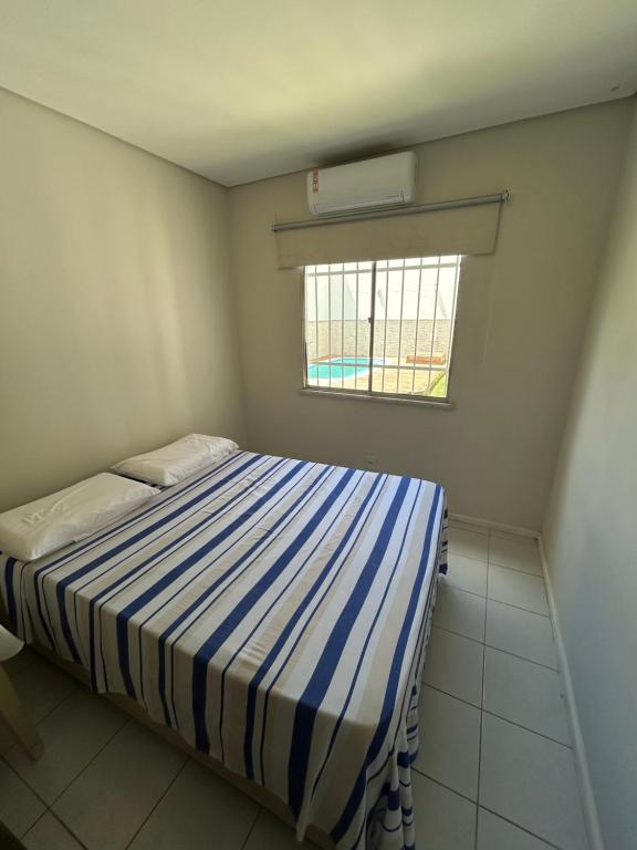 En eller flere senge i et værelse på Casa Porto Mar