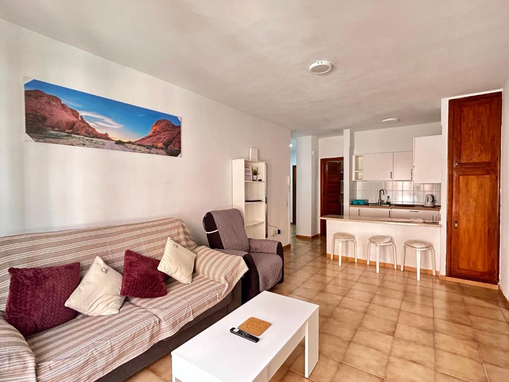 a living room with a couch and a table at Apt In Colina 2, Los Cristianos K105 in El Guincho