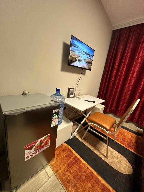 TV a/nebo společenská místnost v ubytování Serenity Haven-Jkia