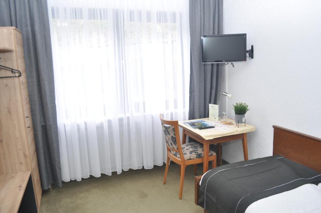 TV a/nebo společenská místnost v ubytování Hotel Kühns Mühle