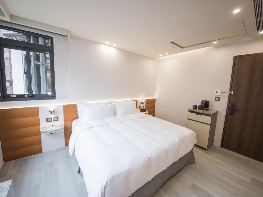 Postel nebo postele na pokoji v ubytování LIVIN Hotel