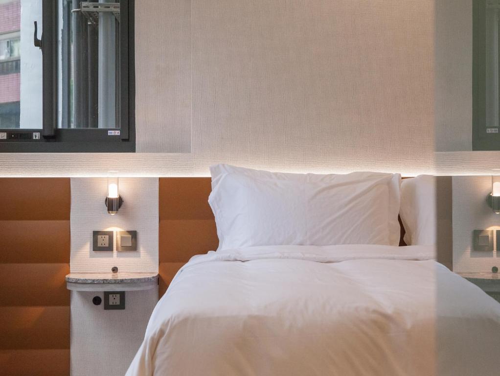 Postel nebo postele na pokoji v ubytování LIVIN Hotel