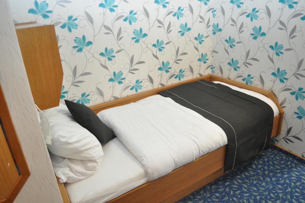 Postel nebo postele na pokoji v ubytování Hotel Kühns Mühle