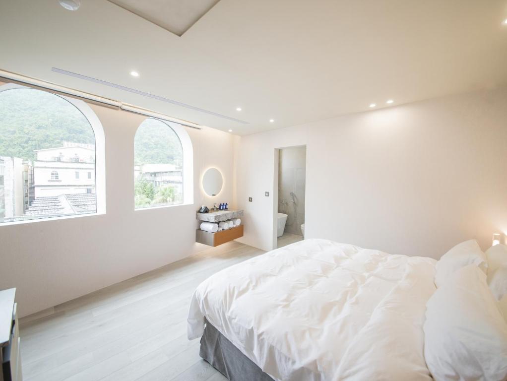 Postel nebo postele na pokoji v ubytování LIVIN Hotel