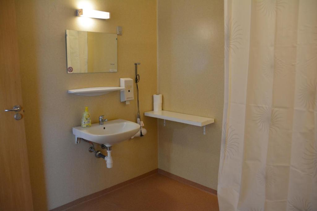 Koupelna v ubytování Abild Hotel