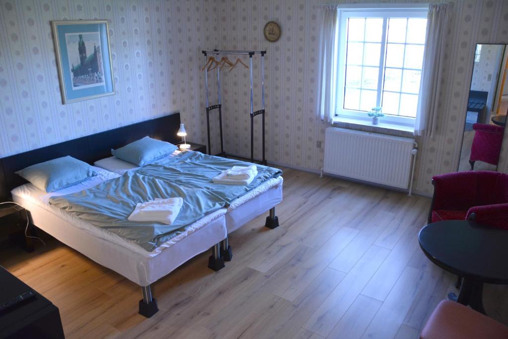 Postel nebo postele na pokoji v ubytování Abild Hotel