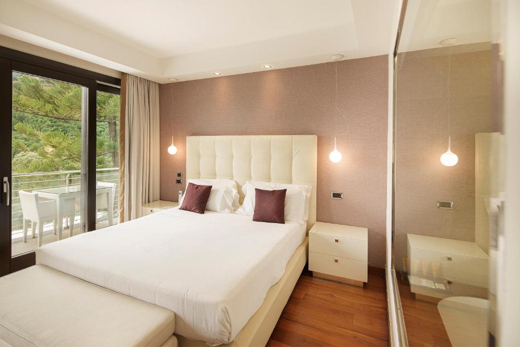 Postel nebo postele na pokoji v ubytování Relais Paradiso