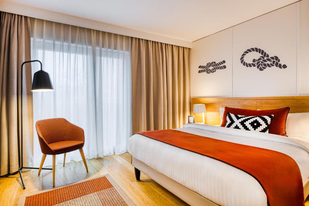Postel nebo postele na pokoji v ubytování Citadines Michel Hamburg