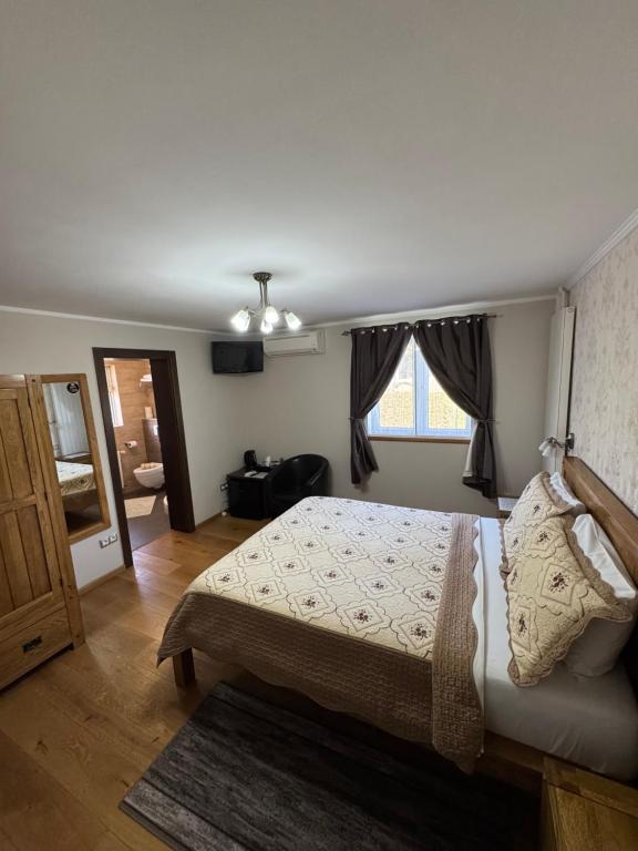 Postel nebo postele na pokoji v ubytování B&B Millenium House