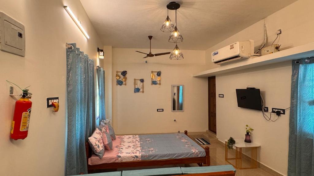 Postel nebo postele na pokoji v ubytování Casa Bonita Pondy