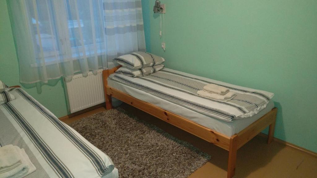 Postel nebo postele na pokoji v ubytování K15HOSTEL guest apartments