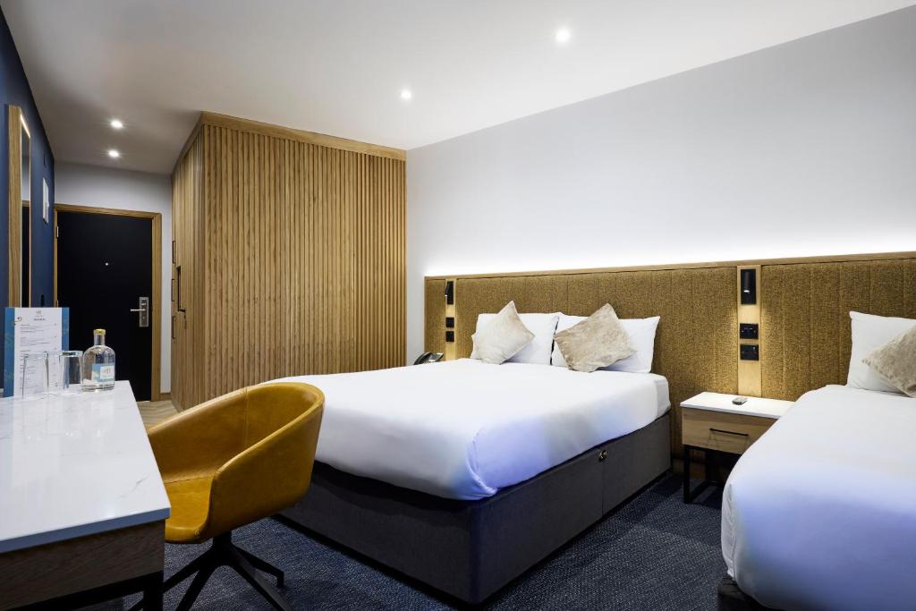 Postel nebo postele na pokoji v ubytování Handel's Hotel