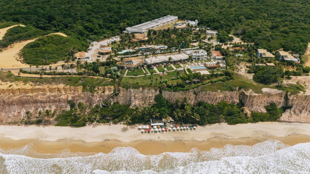 an aerial view of a resort on a cliff at Pipa Ocean Hotel - OFICIAL in Pipa