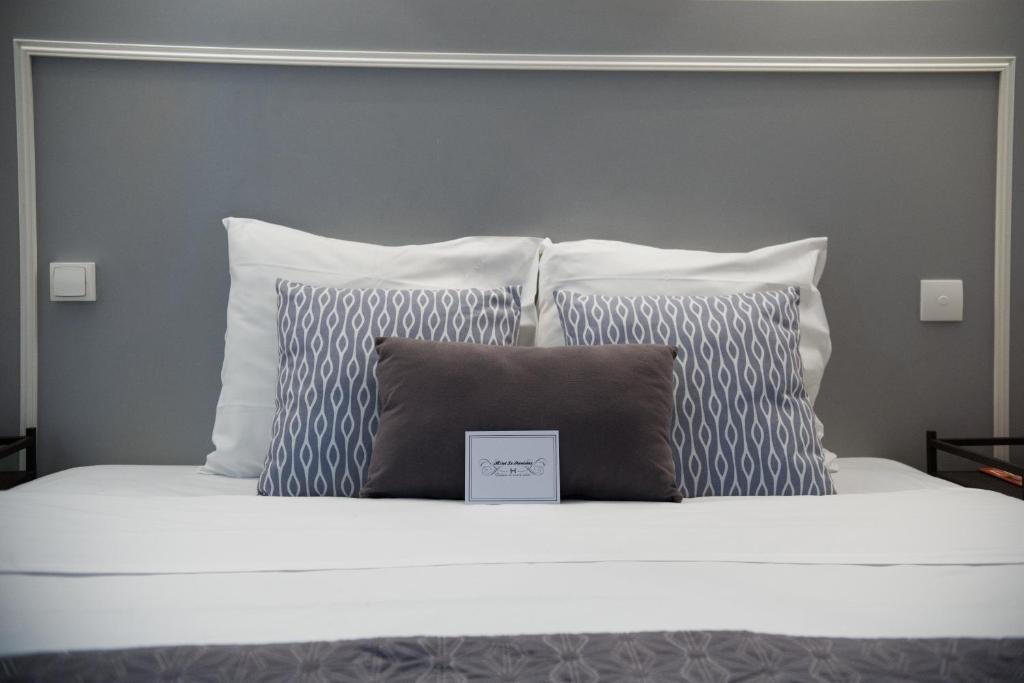Postel nebo postele na pokoji v ubytování Hôtel Le Stanislas