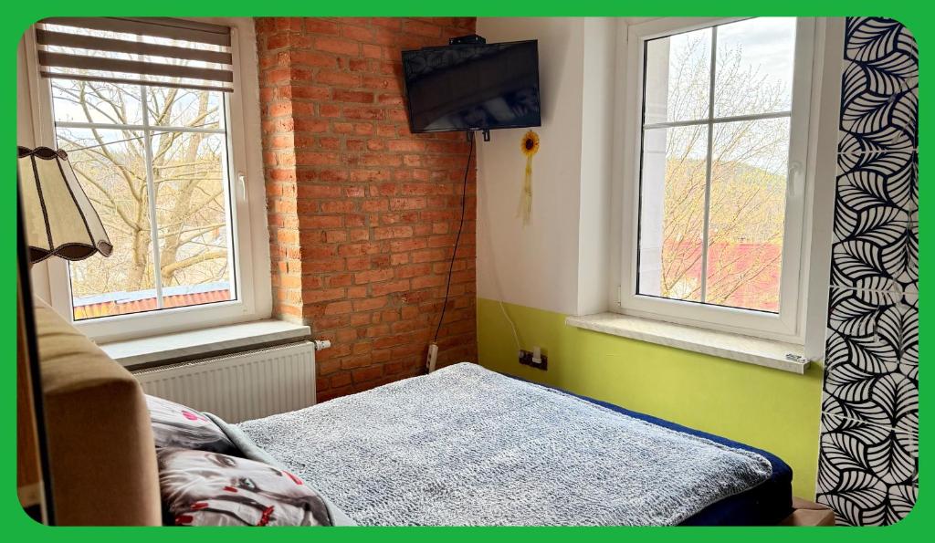 Posteľ alebo postele v izbe v ubytovaní Apartament u Kasi