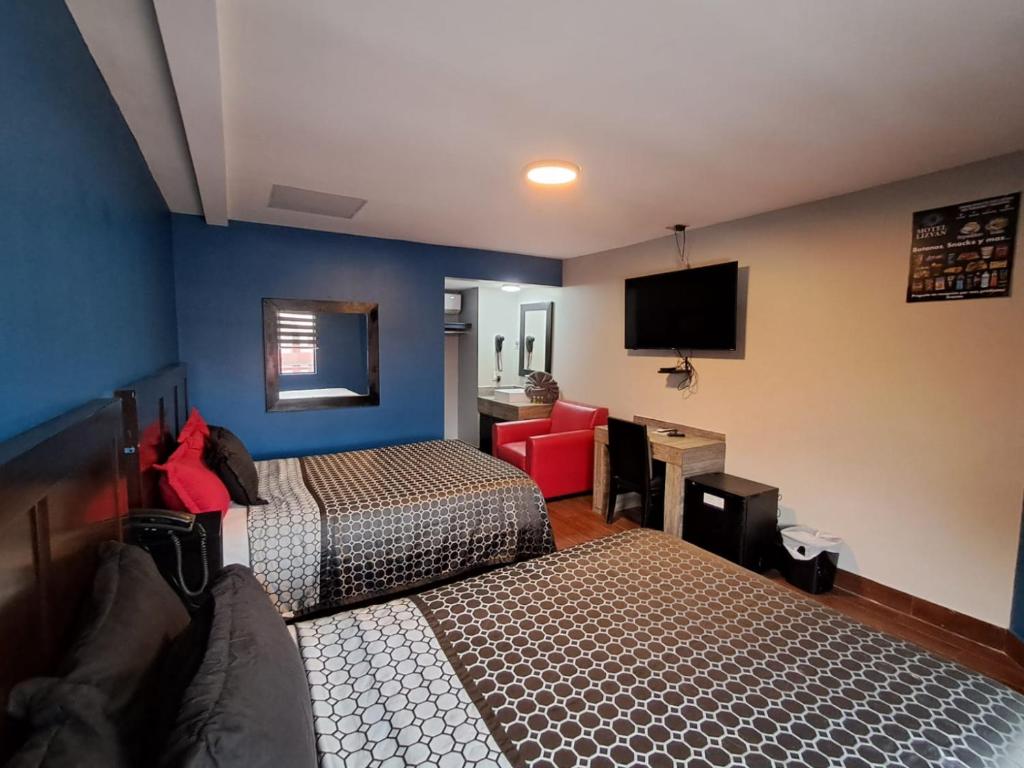 Postel nebo postele na pokoji v ubytování Lizvan Hotel-Motel