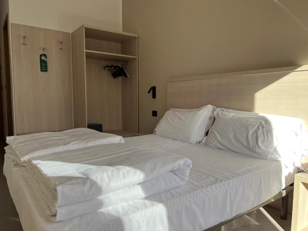 Posteľ alebo postele v izbe v ubytovaní Hotel Coste