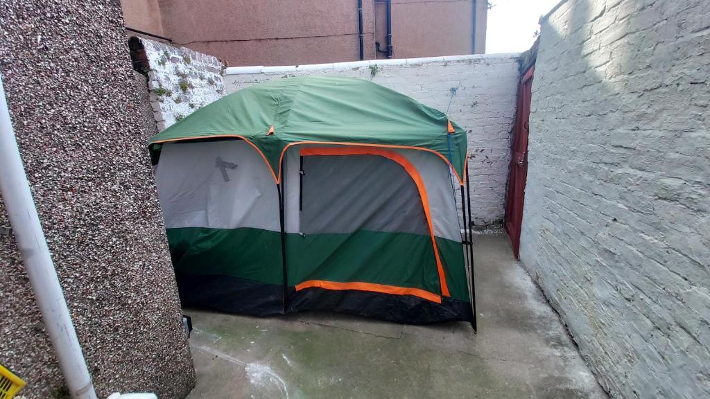 a tent sitting on the side of a building at Phoenix Nights Guest House in Barrow in Furness