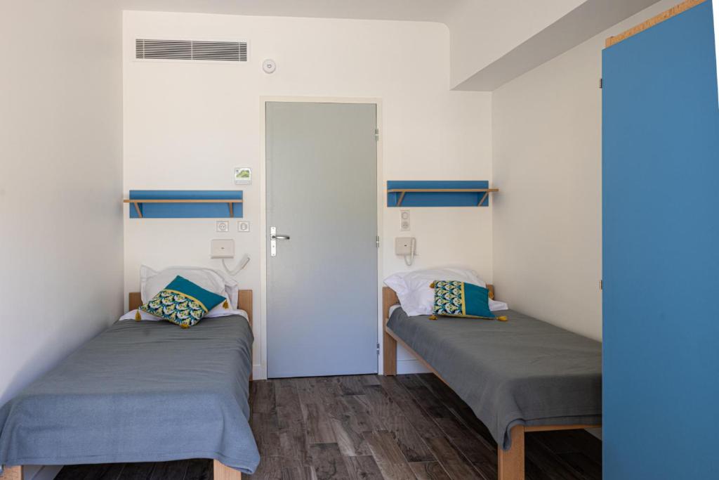 Postel nebo postele na pokoji v ubytování Caravelle 60