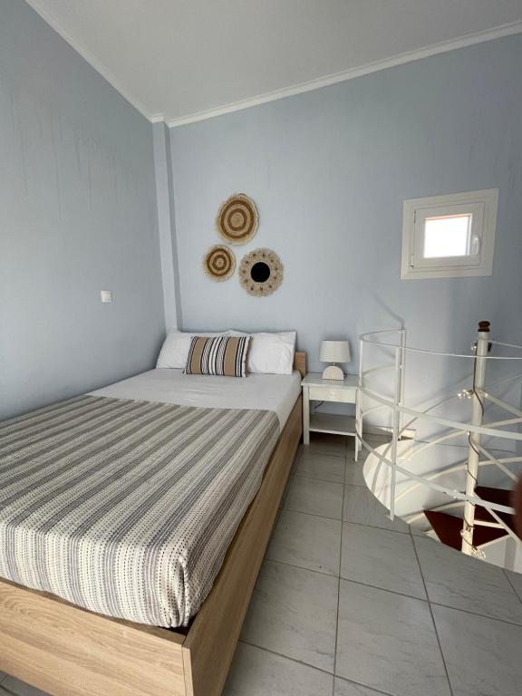 a small bedroom with a bed and a window at The Little Prince in Petra