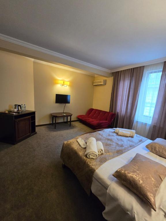 Postel nebo postele na pokoji v ubytování Ritsa Boutique Hotel