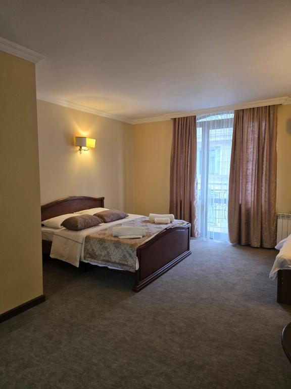 Postel nebo postele na pokoji v ubytování Ritsa Boutique Hotel
