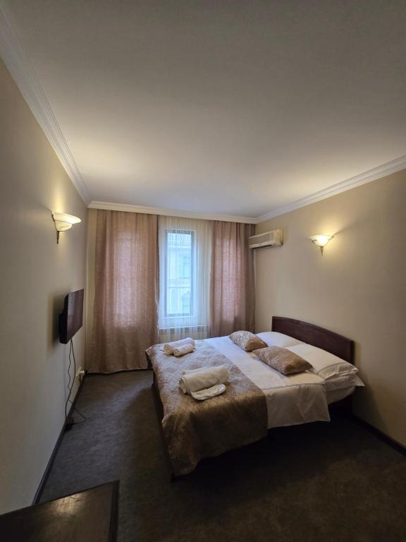 Postel nebo postele na pokoji v ubytování Ritsa Boutique Hotel