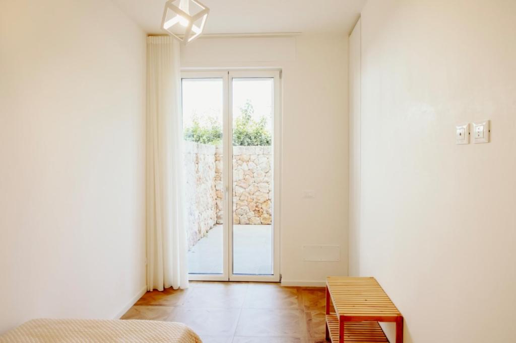 Postel nebo postele na pokoji v ubytování Venti D'Amare Suites
