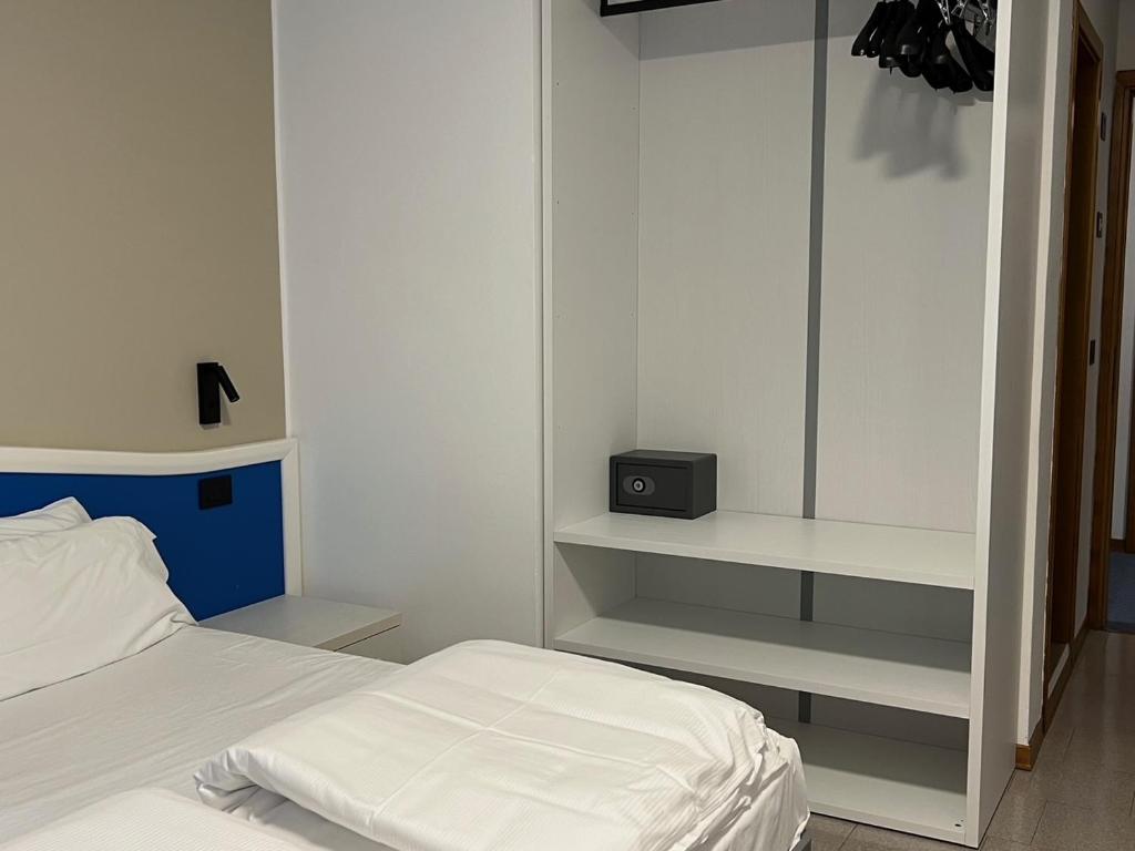 Posteľ alebo postele v izbe v ubytovaní Hotel Coste