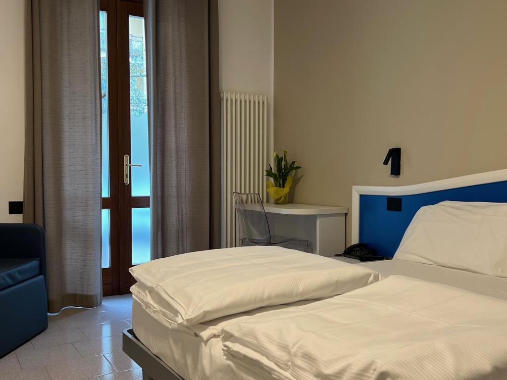 Posteľ alebo postele v izbe v ubytovaní Hotel Coste