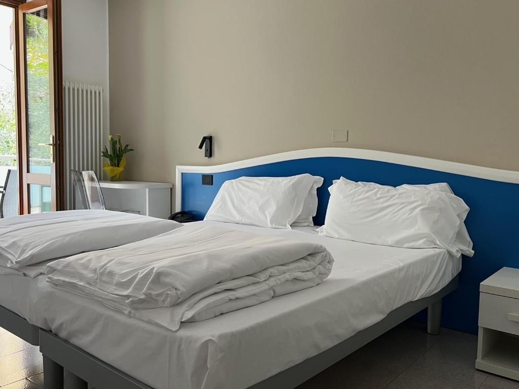 Posteľ alebo postele v izbe v ubytovaní Hotel Coste