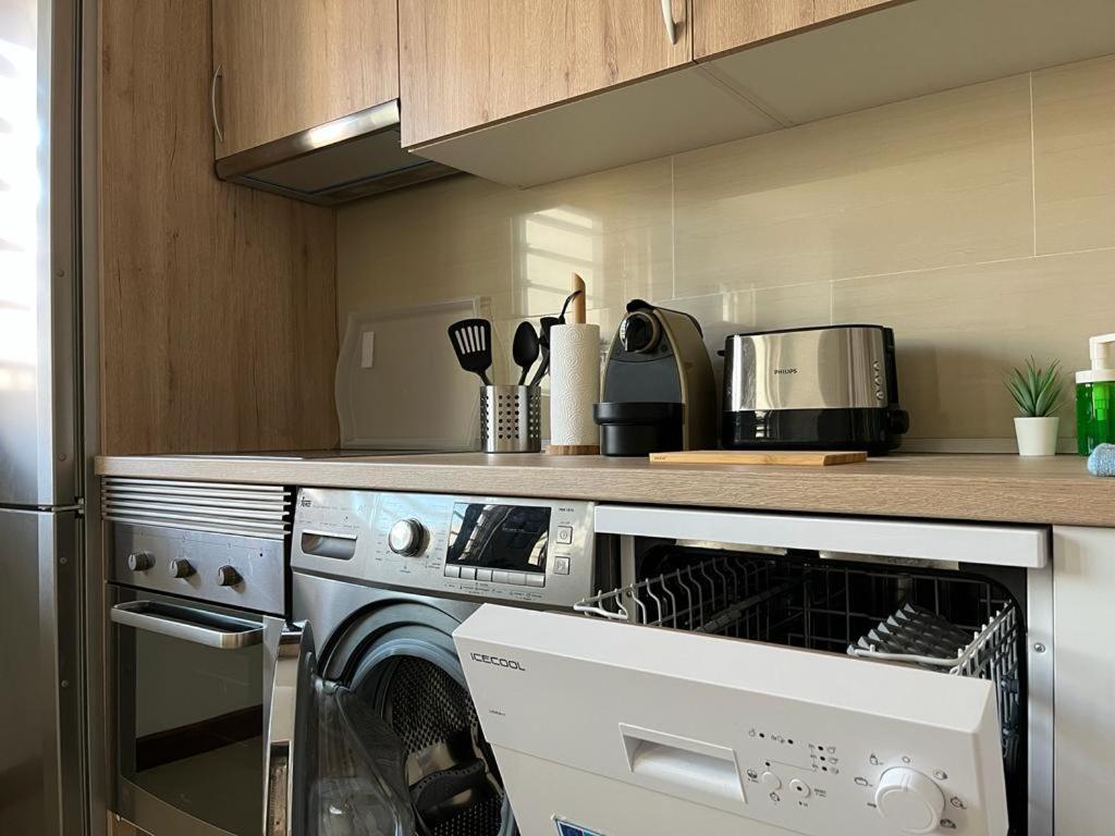 a kitchen with a dishwasher and a counter at Urban, Quiet flat for Digital & Remote Nomads in Santa Cruz de Tenerife