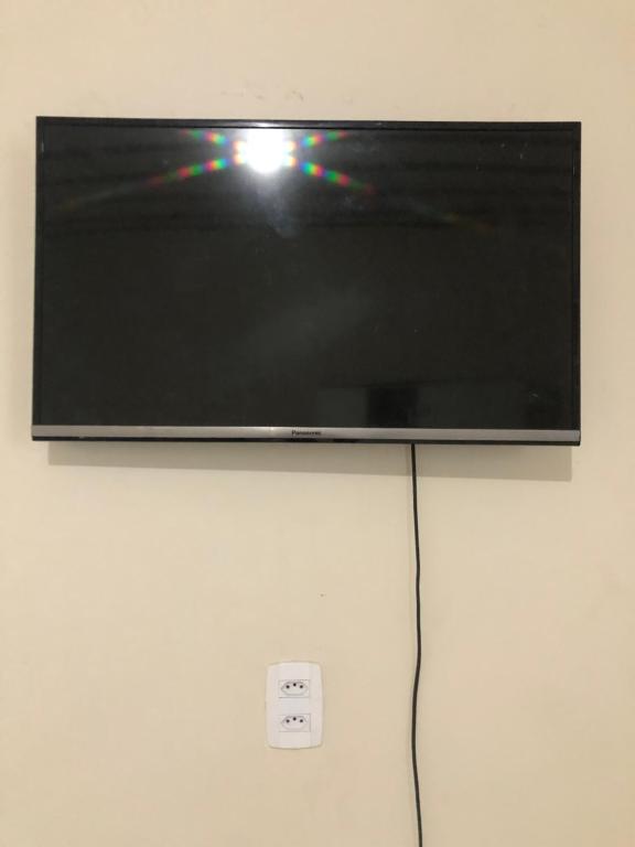 TV a/nebo společenská místnost v ubytování Casa com piscina em Iranduba