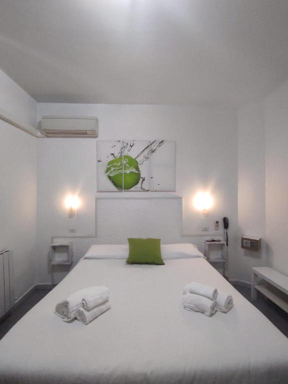 Postel nebo postele na pokoji v ubytování Hotel Birillo