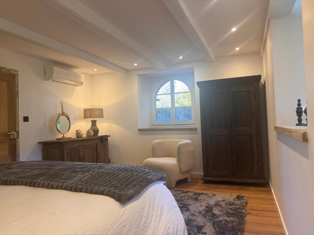 Postel nebo postele na pokoji v ubytování Gîte du domaine de Haut Ghor