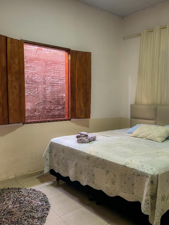 Postel nebo postele na pokoji v ubytování Casa Cantinho Do Sossego Piri