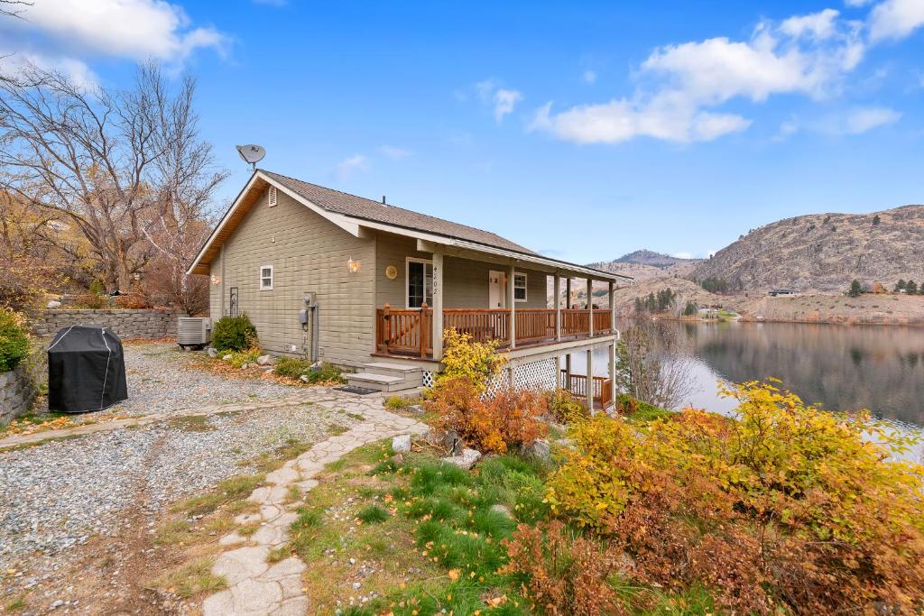a house on the side of a lake at Wapato Lake Waterfront Retreat in Manson