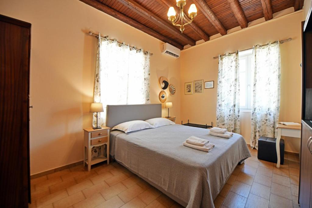 Postel nebo postele na pokoji v ubytování Athina Guesthouse