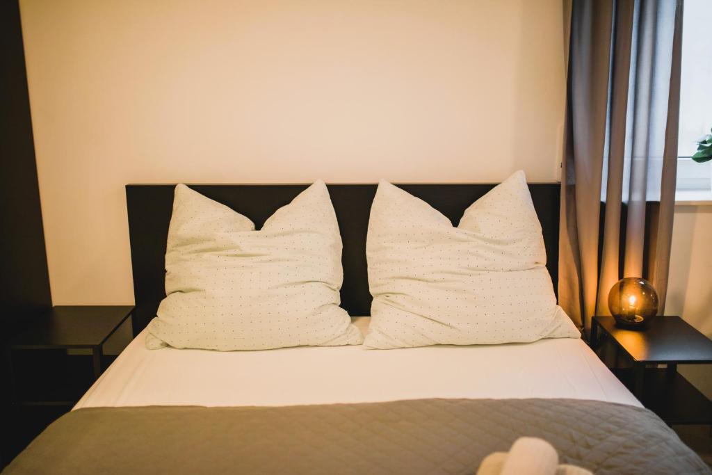Postel nebo postele na pokoji v ubytování HUGOS Studio Apartment