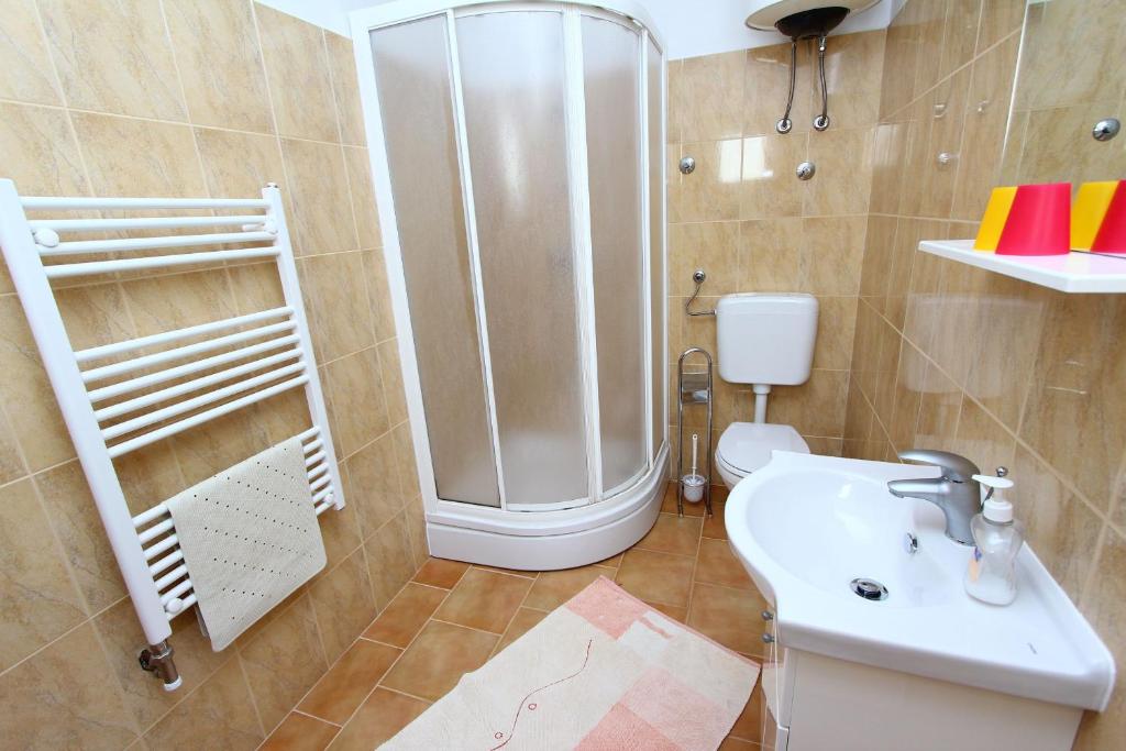 Koupelna v ubytování Apartments Goga