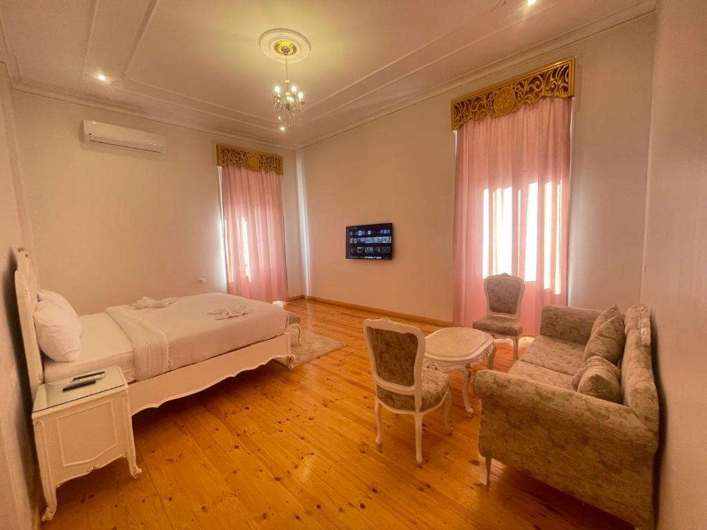 Postel nebo postele na pokoji v ubytování Atum