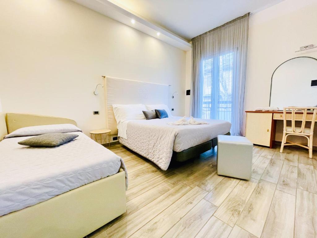 Postel nebo postele na pokoji v ubytování Hotel Tirsus