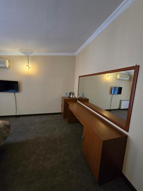 TV a/nebo společenská místnost v ubytování Ritsa Boutique Hotel
