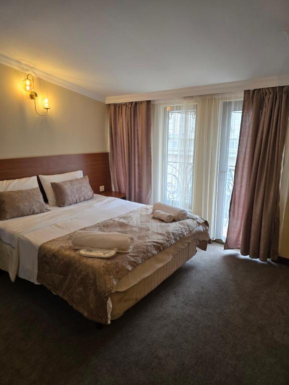 Postel nebo postele na pokoji v ubytování Ritsa Boutique Hotel