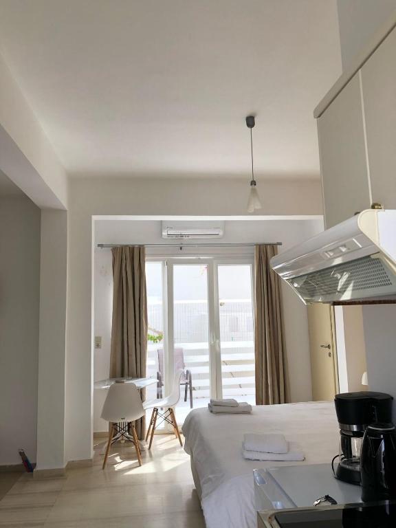 Postel nebo postele na pokoji v ubytování Antonios Hotel Apartments