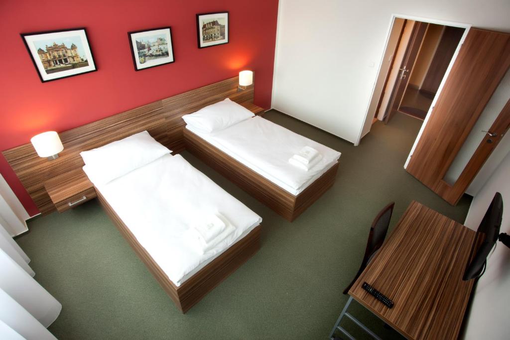 Postel nebo postele na pokoji v ubytování Hotel Veronika