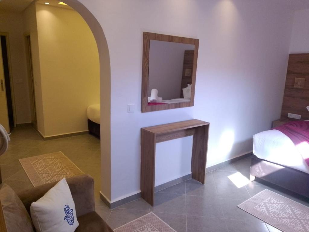 Postel nebo postele na pokoji v ubytování Hôtel Mechouar Plaza