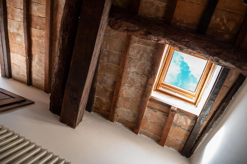 an overhead view of a window in a brick wall at Artistica Pienza - Breathtaking Val d'Orcia View in Pienza