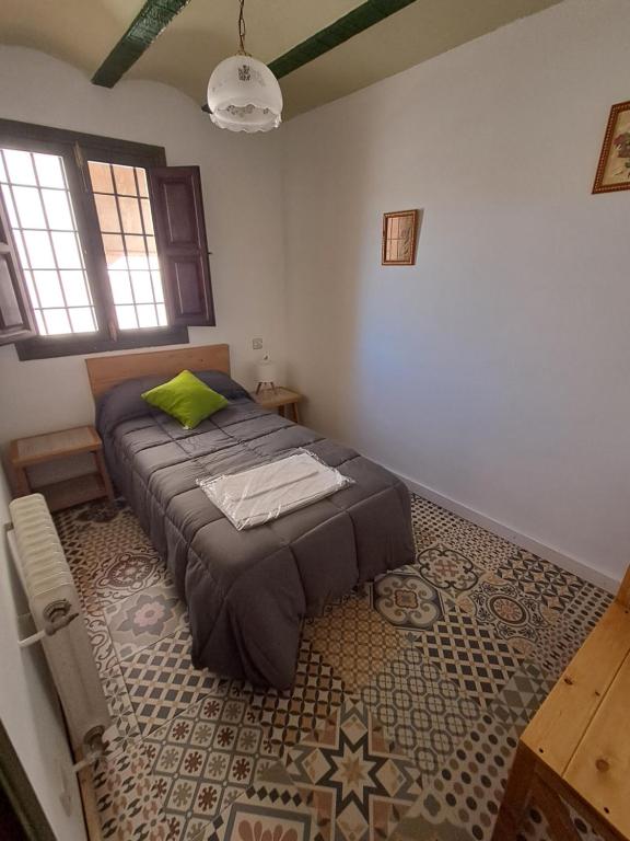 Postel nebo postele na pokoji v ubytování Cortijo Ojos del Prado