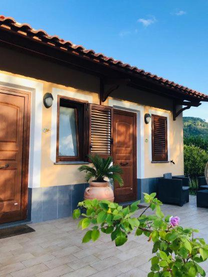 a house with a potted plant in front of it at Tenuta Magrè in Ischia Town